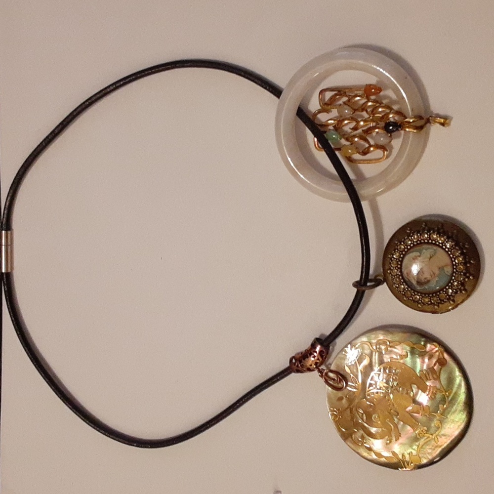 Necklace with three attachments.